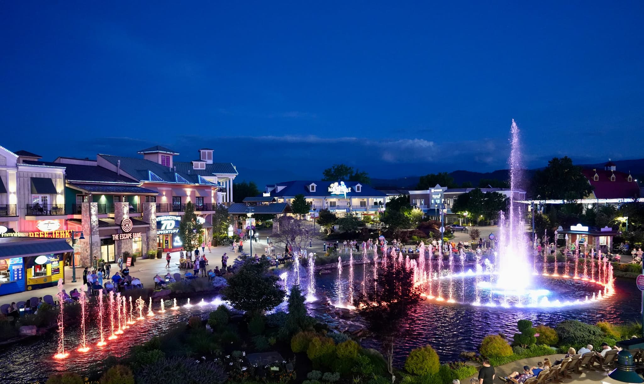 The Island's fountain show lit up at dusk in Pigeon Forge